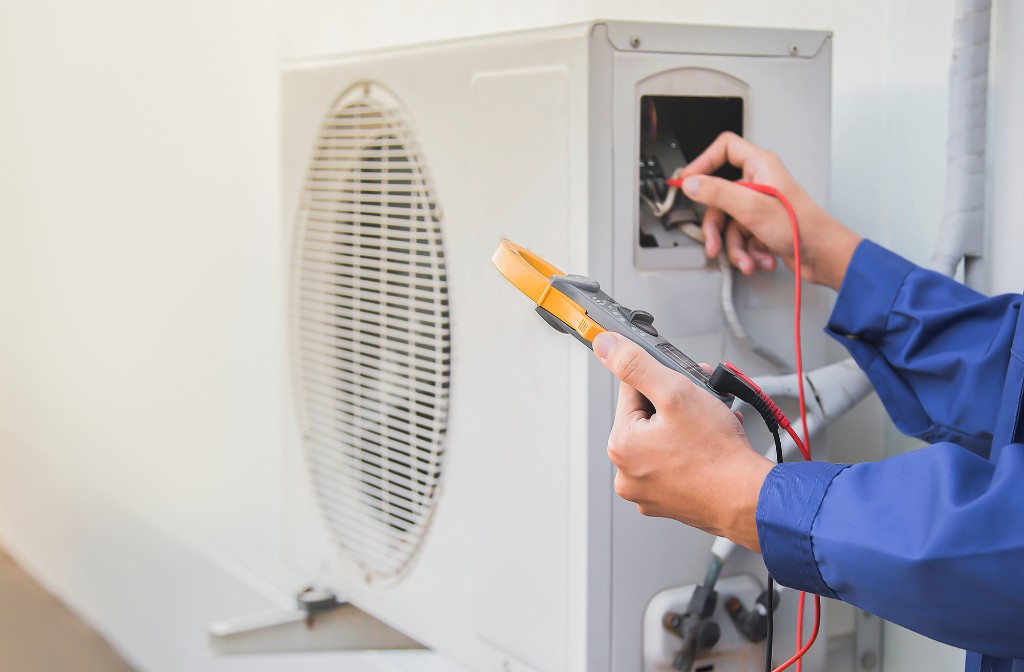 Technician performing HVAC installation and ductwork work